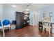 Bedroom with wood floors, ceiling fan, and storage cabinet and view of an adjoining bathroom at 1725 26Th Ave N, North Myrtle Beach, SC 29582
