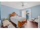Bedroom with wood floors, ceiling fan, and sliding door to a private balcony at 1725 26Th Ave N, North Myrtle Beach, SC 29582