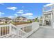 Outdoor deck space offering water views, white railing, and staircase access to upper level at 1725 26Th Ave N, North Myrtle Beach, SC 29582