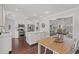 Modern kitchen featuring stainless steel appliances, central island and seamless flow into dining area at 1725 26Th Ave N, North Myrtle Beach, SC 29582