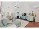 Vaulted living room with fireplace, entertainment center, and comfortable seating with coastal decor at 1725 26Th Ave N, North Myrtle Beach, SC 29582