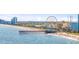 Picturesque aerial view of a pier and beachfront area, showcasing recreational opportunities and a beautiful coastal setting at 2000 N Ocean Blvd. # 1209, Myrtle Beach, SC 29577
