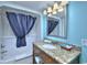 Clean bathroom with shower, granite vanity, sink, and ample lighting, providing a comfortable space at 2000 N Ocean Blvd. # 1209, Myrtle Beach, SC 29577
