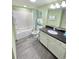 Bright bathroom with a shower-tub, granite vanity, and neutral color scheme at 2007 S Ocean Blvd. # 604, Myrtle Beach, SC 29577