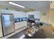 Modern kitchen featuring stainless steel appliances, granite countertops, and ample cabinet space at 2007 S Ocean Blvd. # 604, Myrtle Beach, SC 29577