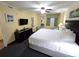 Comfortable bedroom with a large bed, flat-screen TV, and ample storage space at 2007 S Ocean Blvd. # 604, Myrtle Beach, SC 29577