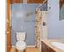 Bathroom featuring toilet, shower with curtain, and granite vanity top with sink at 202 27Th Ave. N, North Myrtle Beach, SC 29582