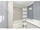 Cozy bathroom featuring a shower-tub combo, neutral tile, and a white vanity at 202 27Th Ave. N, North Myrtle Beach, SC 29582