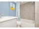 Clean bathroom with tub shower combo and new vanity at 202 27Th Ave. N, North Myrtle Beach, SC 29582