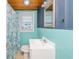 Upstairs bathroom with a shower, sink, window, and blue walls at 202 27Th Ave. N, North Myrtle Beach, SC 29582
