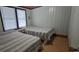 Bedroom featuring two beds with striped patterns and white walls at 202 27Th Ave. N, North Myrtle Beach, SC 29582