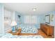 Comfortable bedroom with two twin beds, nautical decor, and natural light at 202 27Th Ave. N, North Myrtle Beach, SC 29582
