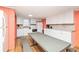 Bright kitchen with dining table, white appliances, and ample counter space at 202 27Th Ave. N, North Myrtle Beach, SC 29582
