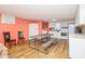 Bright kitchen features white cabinets, modern appliances, and a dining table for convenience at 202 27Th Ave. N, North Myrtle Beach, SC 29582