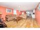 Cozy living room with comfortable sofas, wood floors, and an open layout with adjacent kitchen, perfect for relaxed living at 202 27Th Ave. N, North Myrtle Beach, SC 29582
