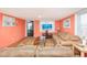 Inviting living room with a large sofa, tv, and bright lighting for a comfortable gathering space at 202 27Th Ave. N, North Myrtle Beach, SC 29582