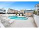 Inviting community pool area features lounge chairs and lush landscaping, ideal for relaxation and social gatherings at 202 27Th Ave. N, North Myrtle Beach, SC 29582