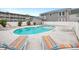 Community pool surrounded by lounge chairs with glimpses of nearby homes, perfect for enjoying sunny days and outdoor living at 202 27Th Ave. N, North Myrtle Beach, SC 29582