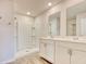 Bathroom with double vanity, white cabinets, and walk in shower at 211 Seasons Trace Loop, Longs, SC 29568