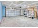 Spacious garage with an automatic door, storage shelves and sealed concrete floor at 211 Seasons Trace Loop, Longs, SC 29568