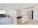 Modern kitchen featuring stainless steel appliances, granite countertops, and white cabinets at 211 Seasons Trace Loop, Longs, SC 29568