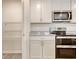 Modern kitchen featuring stainless steel appliances, granite countertops, and white cabinets and pantry at 211 Seasons Trace Loop, Longs, SC 29568
