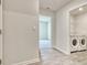 Convenient laundry room with wood look floors and a modern washer and dryer at 211 Seasons Trace Loop, Longs, SC 29568