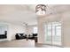 Living room with sliding doors, fan and grey wood-look flooring at 211 Seasons Trace Loop, Longs, SC 29568