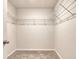 Walk-in closet features white wire shelving and carpet flooring at 211 Seasons Trace Loop, Longs, SC 29568