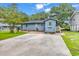Charming home with a spacious backyard, mature trees, and a large driveway for easy parking at 2196 Liberty Circle, Little River, SC 29566