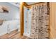 Charming bathroom featuring a shower with a fun fish-themed shower curtain and wood accents at 2196 Liberty Circle, Little River, SC 29566