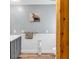 Stylish bathroom featuring a gray vanity, white wainscoting, and natural wood beam at 2196 Liberty Circle, Little River, SC 29566
