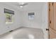 Bright bedroom featuring neutral walls, two windows, and wood-look flooring at 2196 Liberty Circle, Little River, SC 29566