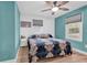 Comfortable bedroom with blue walls, white shiplap accent, and two windows for natural light at 2196 Liberty Circle, Little River, SC 29566