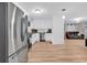 Modern kitchen featuring stainless steel appliances, white cabinetry, and hardwood floors at 2196 Liberty Circle, Little River, SC 29566