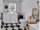 Bright laundry room with modern washer and dryer, updated flooring, and ample storage at 2196 Liberty Circle, Little River, SC 29566