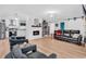 Cozy living room with modern fireplace, stylish furniture, and an adjacent white kitchen at 2196 Liberty Circle, Little River, SC 29566