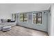 Bright sunroom with large windows, comfortable seating, and views of nature at 2196 Liberty Circle, Little River, SC 29566