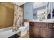 Charming bathroom featuring a tub, vanity, and coastal-themed shower curtain at 2199 Birchwood Circle, Myrtle Beach, SC 29577