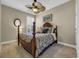 Comfortable bedroom featuring a four-poster bed, ceiling fan, and neutral tones for a relaxing atmosphere at 2199 Birchwood Circle, Myrtle Beach, SC 29577