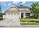 Charming two-story home showcasing a well-manicured lawn, a two-car garage, and an inviting front porch at 2199 Birchwood Circle, Myrtle Beach, SC 29577