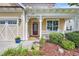 A welcoming covered front porch, beautiful landscaping, and a charming spot to relax and enjoy the outdoors at 2199 Birchwood Circle, Myrtle Beach, SC 29577