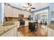 Spacious kitchen featuring stainless steel appliances, a movable island, and an open layout to the dining area at 2199 Birchwood Circle, Myrtle Beach, SC 29577