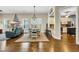 Comfortable living room open to dining area with hardwood floors and plantation shutters at 2199 Birchwood Circle, Myrtle Beach, SC 29577