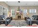 Cozy living room with fireplace, plantation shutters, and comfortable seating at 2199 Birchwood Circle, Myrtle Beach, SC 29577