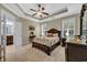 Bright and airy main bedroom with tray ceiling and access to a Primary bathroom at 2199 Birchwood Circle, Myrtle Beach, SC 29577