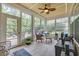 Bright sunroom with tile flooring, ceiling fan, and views of the backyard at 2199 Birchwood Circle, Myrtle Beach, SC 29577