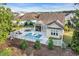 Aerial view of backyard pool and patio area with outdoor seating at 2336 Tidewatch Way, North Myrtle Beach, SC 29582