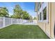 Backyard features a private in-ground pool, turf, and a white fence surrounding the area at 2336 Tidewatch Way, North Myrtle Beach, SC 29582