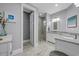 Bathroom with a glass shower, tile floors, a dual sink vanity with granite countertop, and neutral gray walls at 2336 Tidewatch Way, North Myrtle Beach, SC 29582